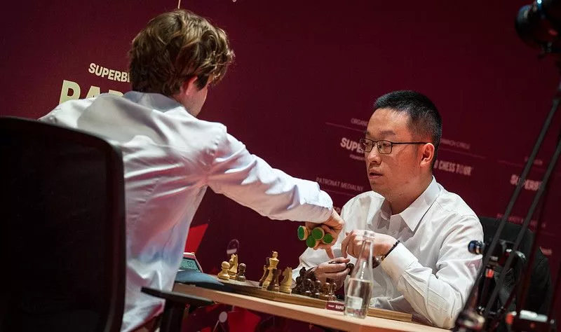 Carlsen y Wei Yi. Foto: Lennart Ootes